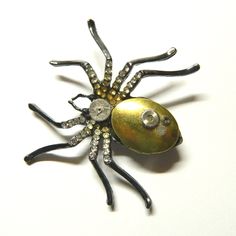 "Black-silver or silver colored steampunk necklace Spider, handmade decorated, including mechanical part of clockwork and miniature container (amulet, talisman, ju-ju, pill box, keepsake locket, stash box). The chain can easily be removed and the necklace turns into a brooch. Diameter of the Spider about: 2\" - 2 1/4\" / 5.5-6 cm Dimensions of the golden locket container: 7/8\" x 5/8\" / 2.2 cm x 1.5 cm; inside 5/8\" x 3/8\" / 1.5 cm x 1 cm Black-silver or silver colored chain. The black spider Victorian Metal Brooches As Gift, Unique Metal Brooch Gift, Handmade Metal Brooches As Gifts, Handmade Metal Brooches For Gifts, Steampunk Locket Jewelry Collectible, Gothic Brooch Jewelry Gift, Silver Steampunk Collectible Jewelry, Steampunk Spider, Golden Locket