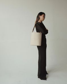 Tall Tote Oat – Freja New York Modern Bucket Bag With Leather Handles For On-the-go, Rectangular Beige Bucket Bag For Work, Beige Bucket Bag With Leather Handles For Work, Minimalist Bucket Bag With Large Capacity, Minimalist Rectangular Bucket Bag For Work, Minimalist Workwear Bag With Leather Handles, Modern Beige Bucket Bag For Everyday, Modern Beige Bucket Bag For Work, Beige Bucket Bag With Adjustable Strap For Work