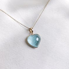 This stunning heart pendant is set in 14K Solid Yellow Gold with Natural Aquamarine with utmost precision. It is an unique gemstone pendant for nearly every occasion and is completely hassle-free jewelry. 🔷ABOUT GEMSTONE: Aquamarine is often considered a calming and soothing stone. It may help reduce stress, anxiety, and feelings of overwhelm, promoting a sense of tranquility and peace. Aquamarine is thought to enhance courage and inner strength. It may help individuals overcome fears and phobi Aquamarine Pendant Jewelry As A Gift, Elegant Aquamarine Gemstone Necklace, Aquamarine Birthstone Pendant Jewelry, Aquamarine Pendant Jewelry For Gifts, Luxury Aquamarine Pendant Necklace, Pisces And Aquarius, Aquamarine Gem, Sparkly Necklace, Handmade Jewelry Box