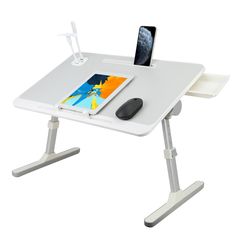 a computer desk with a mouse and tablet on it's stand up table top