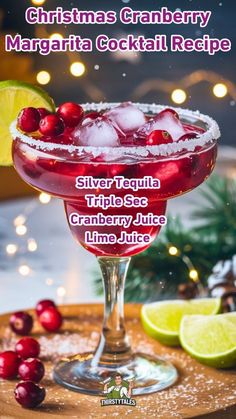 the christmas cranberry margarita cocktail recipe is ready to be served on the table