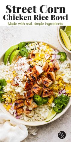 a white bowl filled with chicken and rice next to lime wedges on the side