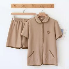 Simple is beautiful, thus, these Cotton Knitted Couple 2 Piece Short Sleeve Pajama Set is ensuring comfort while you sleep. It comes with a buttoned shirt while shorts are at the bottom. It has two little pockets on the shirt which gives it a cute touch. Buying this comfy night suit won't break your bank! This loungewear is all you need to help relax at home. They are soft and easy to touch which projects versatility and effortless grace in every step you take. Made to make you feel good, each o Casual Sets With Pockets For Home, Casual Sleepwear Sets With Buttons, Casual Home Sets With Pockets, Casual Buttoned Sleepwear For Loungewear, Casual Sleepwear With Buttons In Relaxed Fit, Casual Sleep Sets With Buttons, Collared Sets With Buttons For Loungewear, Casual Beige Cotton Sleepwear, Collared Loungewear Sets With Buttons