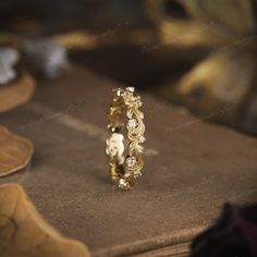 a close up of a gold ring on a book