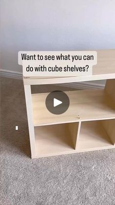 a wooden table with shelves on the bottom and an ad above it that says, want to see what you can do with cube shelves?