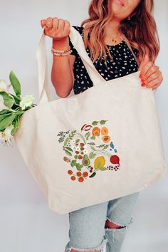 "Our Farmer's Market Illustrative Tote Bag, is the perfect essential accessory for any farmer's market or grocery shopping adventure. Each illustration is lovingly created by artist Tara Danae and created using DTF Vinyl Transfer by professional printers on each bag. * M A R K E T_B E S T_S E L L E R S * Our oversized sturdy, 12 oz heavy-weighted 100% Cotton Canvas tote bags measure 22\"W x 13.3\"H with a 5\" gusset, making them perfect for heavy books, farmer's market goodies, etc. Bags are a standard canvas color. * C A R E_I N S T R U C T I O N S * - Hand Wash only in COLD water and inside out. Or spot clean only. - Hang Dry - Do not bleach or dry clean. * M O R E_I N F O * - Please note that colors may appear differently on monitors and in product photography due to variations in color Organic Tote Bag For Gifts, White Organic Rectangular Bags, White Rectangular Organic Bag, Organic White Rectangular Bags, Organic Rectangular Bags For Everyday Use, Natural Tote Bag For Grocery, Tote Bag Photography Ideas, Farmers Market Tote Bag, Market Tote Bag