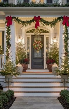 Christmas Lights On Boxwoods, Christmas Home Outdoor, Outside Christmas Lights On House, Traditional Exterior Christmas Decor, Classic Christmas Exterior, White House Christmas Decorations Exterior, Front Porch Christmas Decor Ideas Pillars, Front Christmas Lights, Christmas Porch Decorating Ideas Lights