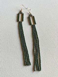 "Hand beaded galvanized teal glass beads on brass rectangles.  5\" length." Bohemian Gold Rectangular Beaded Earrings, Rectangular Gold Beaded Jewelry, Bohemian Jewelry With Large Rectangular Beads, Bohemian Beaded Rectangular Earrings, Elegant Handmade Rectangular Beaded Earrings, Elegant Handmade Beaded Rectangular Earrings, Handmade Elegant Rectangular Beaded Earrings, Bohemian Rectangular Beaded Earrings With Dangling Beads, Bohemian Square Beaded Jewelry