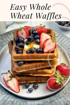 a stack of waffles with strawberries and blueberries on top, next to the words easy whole wheat waffles