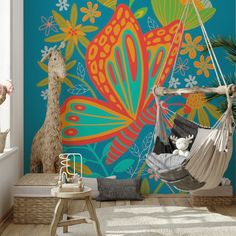 a child's room with a colorful wall mural and hanging hammock chair