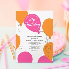 a birthday party with pink and orange balloons