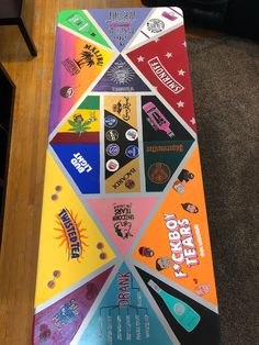 a skateboard with many different stickers on it