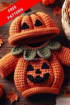 a crocheted pumpkin with a hat on it's head sitting next to some leaves