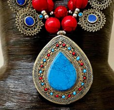 Since this is an older piece, I am open to considering reasonable best offers. Please email me. _____________________________________________________________________________________________ This stunning, jaw drop creation is from my private vault, and unworn. It is a big, bold, chunky and heavy beaded chest piece comprised of red, blue and green magnesite round beads with shiny silver tone metal balls. 12 lapis lazuli fancy filigree charms are suspended from the outer most strand and a blue and Red Bohemian Necklace With Large Pendant, Red Bohemian Jewelry With Intricate Design, Traditional Red Pendant Beaded Necklace, Traditional Red Beaded Pendant Necklace, Traditional Red Jewelry For Festival, Festive Bohemian Beaded Necklaces With Natural Stones, Artisan Red Beaded Necklaces For Festivals, Artisan Red Beaded Necklace For Festivals, Red Pendant Beaded Necklace For Festivals