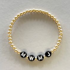 The 'My People' bracelet allows you to customize your bracelet with the initials of those you love to always keep them close. Made with your choice of 4mm or 6mm (pictured) 14k gold filled with your initial personalization in white or black. Easy wear and effortless stacking with sturdy stretch cord design. Please enter your personalization (exactly how you would like it to appear on the bracelet). Contact us if you have a sizing question or need a custom size. Classic Hypoallergenic Name Bracelet For Everyday, Classic Hypoallergenic Name Bracelet, Classic Everyday Hypoallergenic Name Bracelet, Minimalist Personalized Jewelry With Round Beads, Minimalist Jewelry With Letter Round Beads, Minimalist Jewelry With Round Letter Beads, Classic Personalized Beaded Bracelets For Everyday, Everyday Yellow Gold Personalized Bracelets, Minimalist Letter Beads Jewelry For Friendship