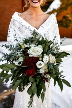 Stunning bridal floral bouquet with red and white roses and greenery. Winter Wedding With Red Accents, Bridal Bouquet Christmas Wedding, Winter Bouquet Aesthetic, Berry Winter Wedding, December Wedding Bouquets Brides, Christmas Wedding Picture Ideas, Wedding Bouquets Red And White, Winter Wedding Bouquet Ideas, December Bridal Bouquet