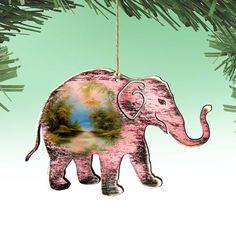 an elephant ornament hanging from a christmas tree