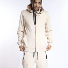 Our New Tech Fleece Hoodie And Jogger Set In Sand Color. These Comfy Stylish Jogger Set Are Perfect For Everyday And Casual Styling. Drawstring Closure Elasticated Waistband & Amkle Zip Up Pockets 55% Cotton 40% Polyester 5% Spandex Model Is 5'10 & Wear M/32 Hooded Fleece Tracksuit With Kangaroo Pocket, Fleece Tracksuit With Hoodie And Pockets, Fleece Hoodie Tracksuit With Pockets, Fleece Tracksuit With Kangaroo Pocket In Athleisure Style, Hooded Tracksuit With Kangaroo Pocket, Hooded Fleece Tracksuit With Pockets, Hooded Fleece Tracksuit With Ribbed Cuffs, Fleece Tracksuit With Ribbed Cuffs And Hood, Fleece Hooded Tracksuit With Ribbed Cuffs