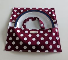 a red and white polka dot lunch bag