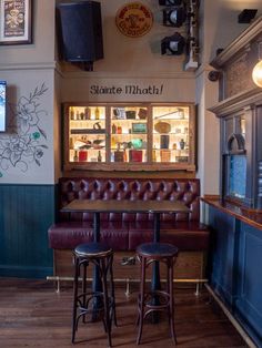 two stools sit in front of the bar at shanate's pheatch