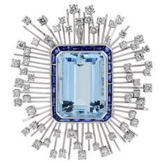 This brooch is designed with aquamarine stone in the center with the total carat weight of 35.03 accented with sapphire with the carat weight of 3.70 and diamonds with the total carat weight of 3.55. Sophia D by Joseph Dardashti LTD has been known worldwide for 35 years and are inspired by classic Art Deco design that merges with modern manufacturing techniques. Aquamarine Stone, Art Deco Design, Birthstone Jewelry, Classic Art, Aquamarine, Brooches, Platinum, Sapphire, Art Deco