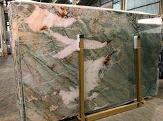 large green marble with gold accents in a warehouse