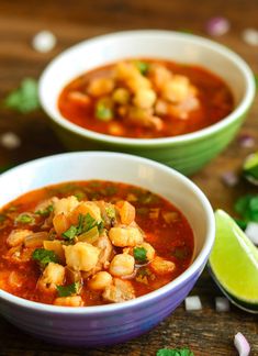 two bowls filled with soup and garnished with cilantro