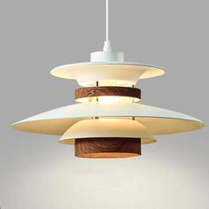 three light fixtures hanging from a ceiling fixture