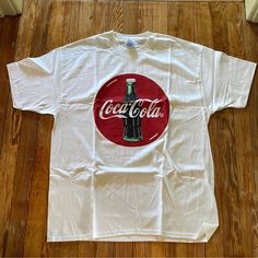 This Is A Vintage Tee Shirt From The 90’s. It Is A Men’s X-Large Coca Cola Tee. This Has Been In My Closet For Years And Never Worn. Cleaning Out The Closets To Move To Fl. From A Pet And Smoke Free Home. Arm Pit To Arm Pit 23’’ Full Length 32’’ Arm Pit To Length 17.5’’ Male Graphic Tees, Batman Merch, Coca Cola Shirt, Vintage Tee Shirt, Merch Design, Vintage Tee Shirts, Clothing Pieces, Mens Casual Dress Outfits, Shirts Vintage