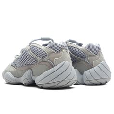 The latest iteration of the Yeezy 500 introduces the ‘Stone Salt’ colorway which follows Kanye West’s monochromatic and neutral aesthetic. Suede and mesh fabric work in tandem to craft the upper for a structured and breathable silhouette. The upper seamlessly transitions into the rubber outsole as it protects the integrity of the shoe and encases the adiPRENE technology that offers extreme cushioning. Featured details included embossed branding, a lace closure, and a tongue pull-tab for easy app Human Race Shoes, Easy App, Yeezy Fashion, Grey Jordans, Grey New Balance, Fabric Work, Yeezy 500, Neutral Aesthetic, Air Jordan 3 Retro