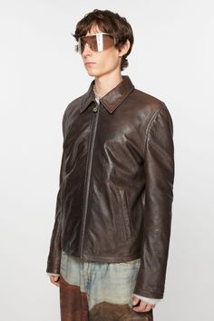 <div>Zipper jacket is cut to a regular fit and hip length. Crafted from nappa leather with a painted finish , detailed with an Acne Studios trademark logo on the lower back sleeve.</div> Classic Leather Jacket With Zip Cuffs, Designer Leather Jacket With Long Sleeves And Concealed Placket, Designer Leather Jacket With Concealed Placket, Designer Leather Jacket With Zip Cuffs, Trademark Logo, Studio Logo, Cuff Detail, Brown Leather Jacket, Zipper Jacket