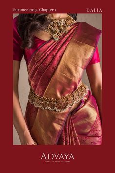 a woman in a red and gold sari with the words adwaya written on it