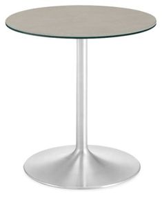 a round table with a metal base and an oval glass top on a white background