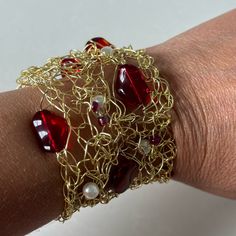 Unique Artisan Made Bracelet With Gold Wire, Red Glass And Faux Pearl Beads. Magnetic Closure That Is Secure. Makes A Statement! Never Worn. Slight Fading On Magnetic Clasp Area. Elegant Red Beaded Bangle Bracelet, Red Metal Crystal Bracelet Gift, Handmade Elegant Red Crystal Bracelet, Elegant Handmade Red Crystal Bracelet, Red Metal Beaded Bracelet With Round Beads, Handmade Adjustable Red Pearl Bracelet, Handmade Red Adjustable Pearl Bracelet, Handmade Red Metal Bracelets, Handmade Elegant Red Bracelets