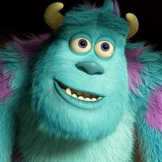 an animated blue monster with horns and big eyes