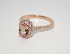 Description: BEAUTIFUL 14K ROSE GOLD LADIES DIAMONDS AND MORGANITE RING. THIS ITEM IS NEW IT COMES WITH GIFT BOX. WE DO OFFER FREE SIZING. IF YOU HAVE ANY OTHER QUESTIONS PLEASE CONTACT US. ALL THE INFO ON THIS ITEM DOWN BELOW. THANK YOU VERY MUCH. KATE .Metal: SOLID 14K ROSE GOLDStamped: 14K Total Gram Weight: 3.7GRRing Size: 6.5 (RESIZEBLE)Setting: PRONG WidthTop: 12.6MMWidth Bottom: 1.6MMStones: 100% NATURAL DIAMONDSColor: FClarity: VS2-SI1Shape: ROUND BRILLIANT CUT DIAMONDSTotal Carat Weight Luxury Oval Wedding Ring, Luxury Oval Morganite Wedding Ring, Classic Rose Gold Morganite Wedding Ring, Oval Morganite Wedding Ring With Brilliant Cut, Oval Pink Gold Diamond Ring For Formal Occasions, Oval Pink Gold Diamond Ring, Formal Oval Pink Gold Diamond Ring, Luxury Oval Morganite Wedding Ring With Halo Setting, Oval Morganite Diamond Ring For Wedding