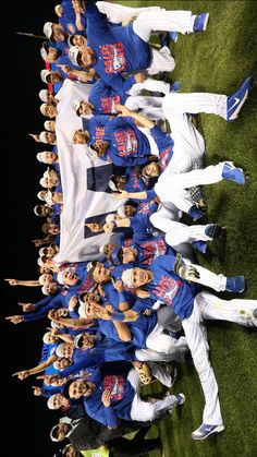 a group of baseball players standing next to each other