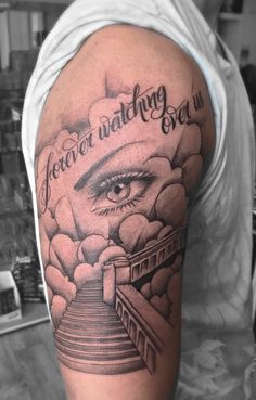 a man's arm with an eye on it and the words, forever watching over us