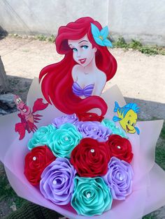 the little mermaid bouquet has been made with paper flowers and is ready to be delivered