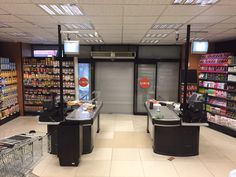 an empty grocery store filled with lots of items