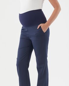 Four way stretch active fabric waistband Wide leg silhouette Side pockets Inseam length: 78cm The Emma Overbelly Straight Pant is our answer to your corporate maternity wardrobe needs! This pant is made from a lightweight crease resistant suiting fabric, giving it a professional finish. The overbelly waistband, which is in our four way stretch active fabric, allows you to feel comfortable and secure and can also be worn folded down below the bump. The pants feature side pockets and closed welt p Pregnancy Wardrobe, Pre Pregnancy, Straight Pants, New Day, Wide Leg, Navy, Wardrobe, Pants, Fabric