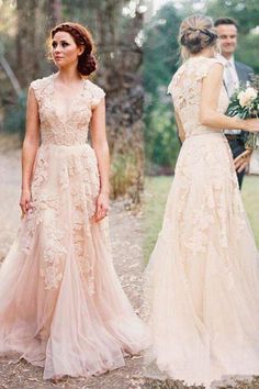 two women in wedding dresses standing next to each other