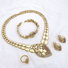 Afraic Jewelry -Jewelry Sets For Women Italian 18k Gold Plated Jewelry Rhinestone Necklace Sets Wedding Party Gift product name: Latest jewelry set designs for women material: zinc alloy keyword: Dubai Gold Color Fashion Jewelry Style: Latest jewelry set for women Style: TRENDY Shape\pattern: Flower Plating color: Gold Plating Origin: Mainland China Occasion: wedding Model Number: 215 Metals Type: Zinc alloy Material: Metal Jewelry Sets Type: Necklace/Earrings/Ring/Bracelet Item Type: Jewelry Sets Included Additional Item Description: Necklace earring ring bracelet Model Number:3256804018715340 Product information: Material: Zinc Alloy Color: Gold Color Product Package Details: 1 Set (Neckace, Bracelet, Earrings,Ring ) PRODUCT GENERAL STYLE:Elegant simple fashionable and luxurious show you Metal Jewelry For Wedding, Plated Alloy Jewelry Sets For Wedding, Gold Alloy Wedding Jewelry, Wedding Alloy Plated Jewelry Sets, Plated Alloy Wedding Jewelry, Wedding Jewelry Sets In Plated Alloy, Wedding Alloy Plated Jewelry, Elegant Alloy Jewelry As Gift, Hand Set Gold Jewelry For Anniversary