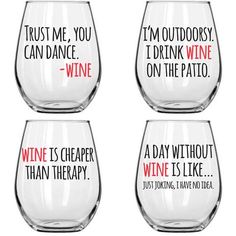 four wine glasses with different sayings on them