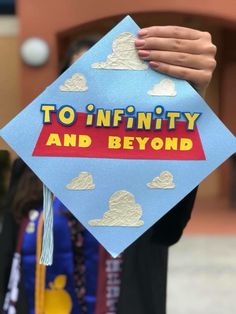 a blue graduation cap with the words to infinity and beyond