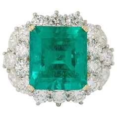 A DIVINE Emerald!! 11.05 GIA certified Colombian Emerald cut Emerald 4.62 carats of white round brilliant cut and marquise cut diamonds. Platinum and 18k yellow gold. size 6.75, this ring can easily be resized. 21.1 mm x 24.13 mm approximately 7 Carat Diamond Ring, Antique Emerald Engagement Ring, Emerald Statement Ring, Antique Emerald Ring, Yellow Gold Cocktail Ring, Emerald Ring Vintage, Marquise Shape Diamond, Emerald Rings, Emerald And Diamond Ring