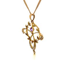 FREE shipping on all orders! FREE 5 Day Returns! Learn More. True Romance is an amazing, one-of-a-kind, turn of the 20th century, vintage necklace, featuring a delicate circular and trefoil pendant adorned with one old mine cut diamond, a square cut amethyst, and 17 seed pearls. This is truly a work of art and is stunning. The 10K yellow gold necklace is 18.5" with a spring ring closure. The total approximate weight including all materials is 3.10 dwt. Center Diamond: Old Mine Cut; Color Grade: Vintage Necklace With Flower Pendant, Vintage Hallmarked Flower Pendant Necklace, Heirloom Pendant Necklace With Rose Cut Diamonds, Antique Hallmarked Flower Pendant Necklace, Collectible Yellow Gold Necklaces With Intricate Design, Collectible Yellow Gold Necklace With Intricate Design, Antique Diamond Necklace With 17 Jewels For Anniversary, Heirloom Diamond Pendant Necklace, Collectible Intricate Yellow Gold Necklace