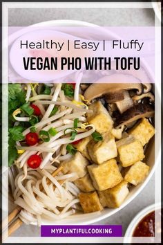 healthy vegan pho with tofu in a white bowl on top of a table