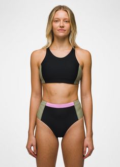 A color-blocked athletic bikini top with UPF50+ protection designed to stay put during active days. Functional Black Swimwear For Yoga, Sporty Swimwear With Medium Support, Sporty Swimwear With Contrast Color For Sports, Sporty Contrast Color Swimwear For Sports, Black Color Block Activewear For Summer, Sporty Color Block Swimwear For Sports, Sporty Color Block Sports Bra For Training, Summer Black Color Block Activewear, Functional Black Color Block Activewear