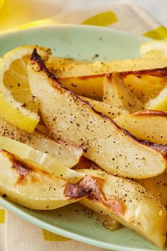 potatoes with seasoning and lemon slices on a plate